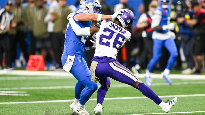 vikings safety theo jackson tries to tackle a tight end 
